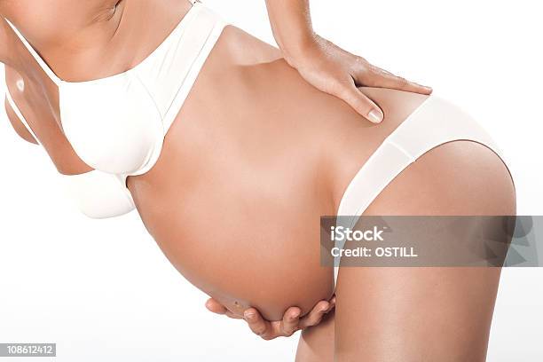 One Pregnant Woman Detail Backache Stock Photo - Download Image Now - Pain, Pregnant, Studio Shot