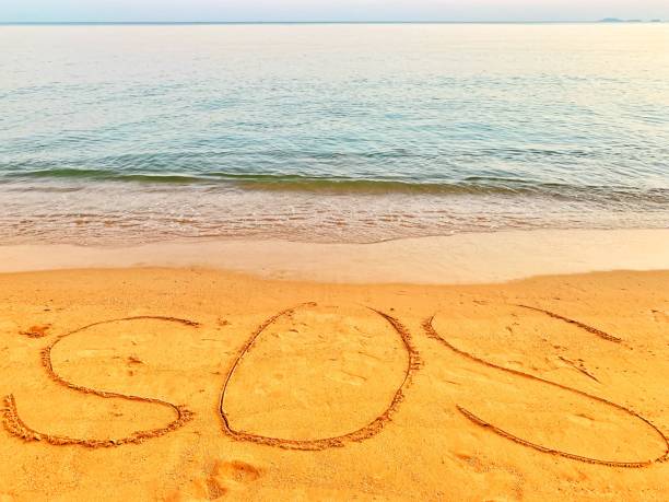 istock sos draw in the beach 1086127558