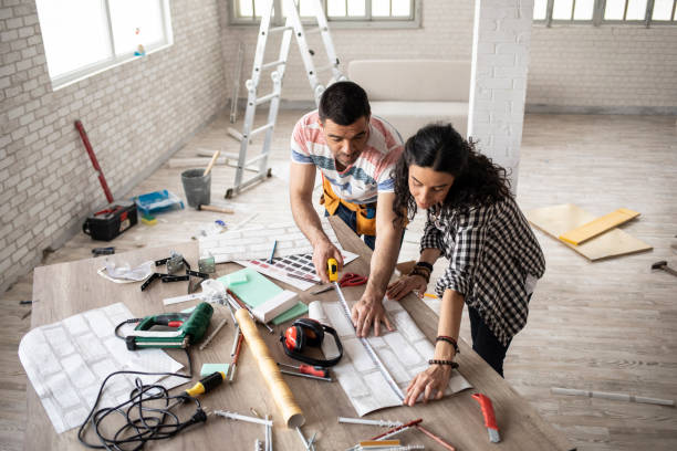 Couple making home improvement and measuring