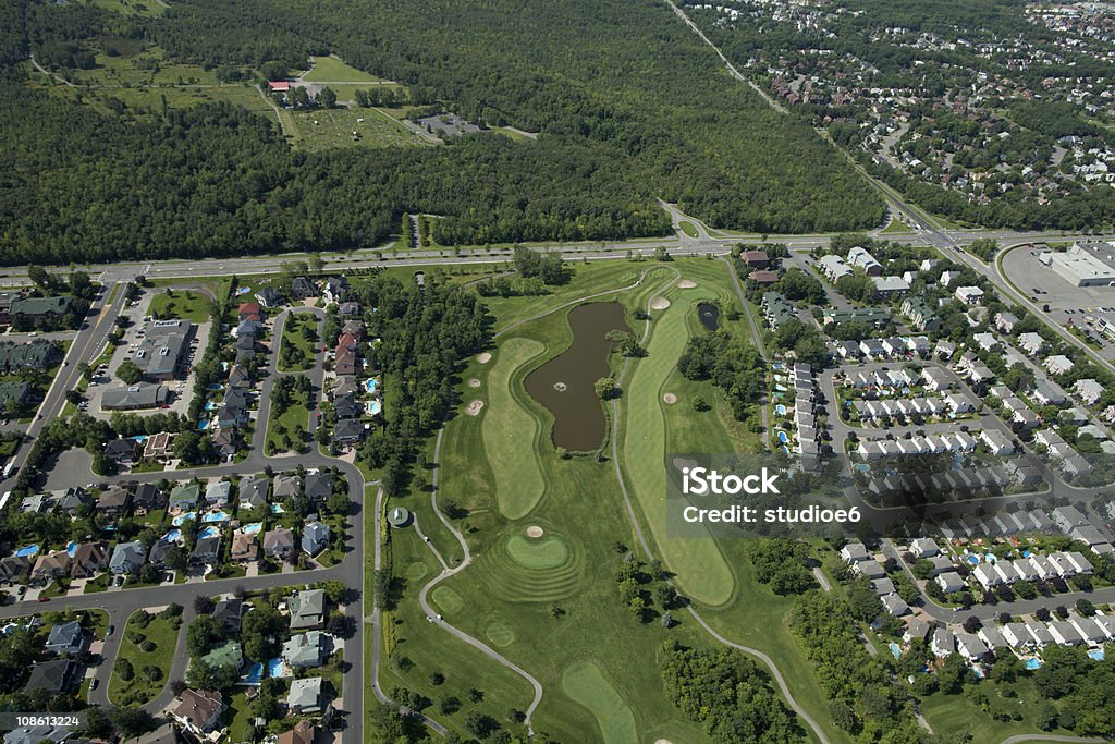 Golf and Homes Aerial Aerial of golf course and homes in a sub-urban developement. Housing Development Stock Photo