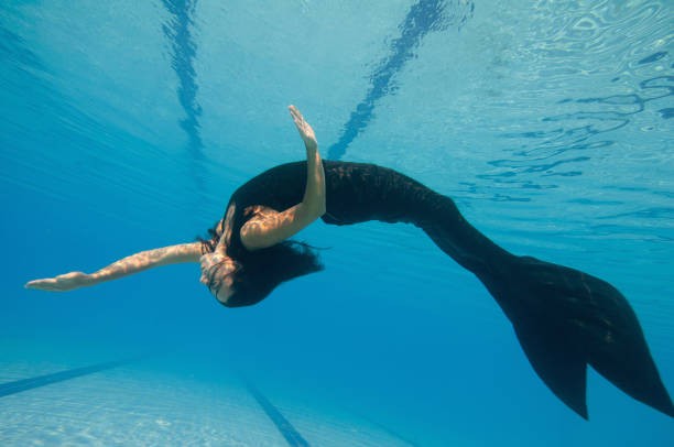 istock Female Model Swimming In Pool 1086136552