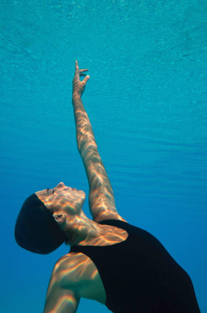 istock Female Model Swimming In Pool 1086136566