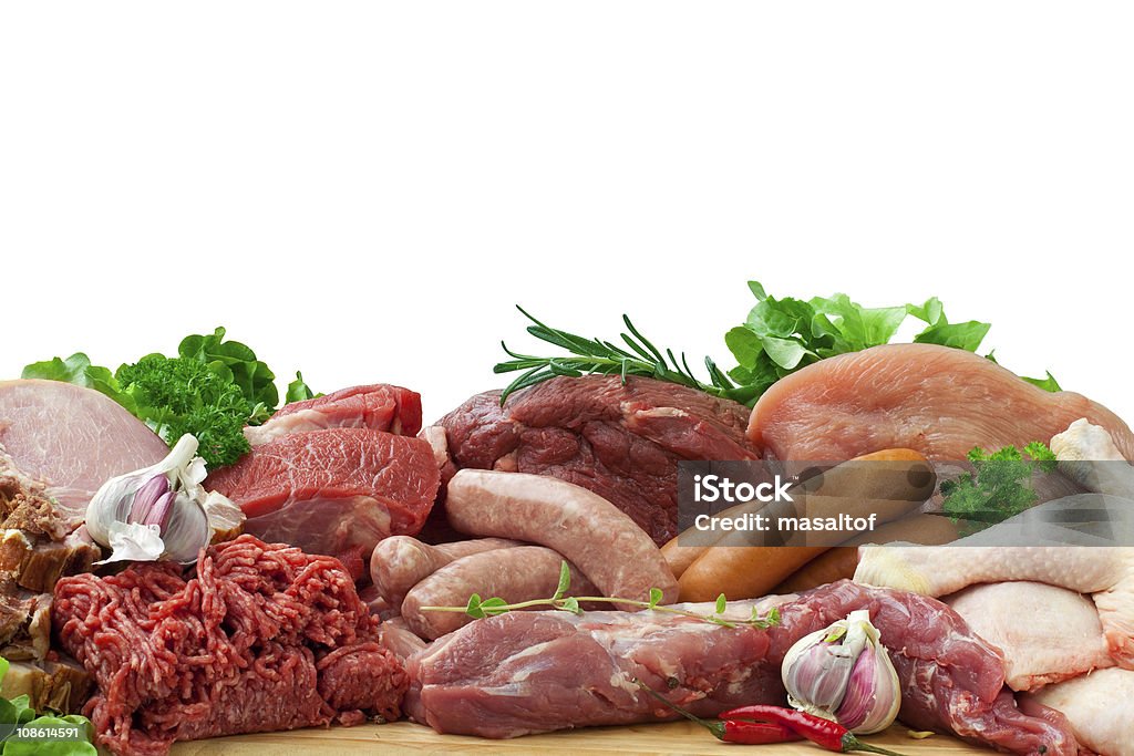 assorted raw meats Fresh butcher cut meat assortment garnished with Salad and fresh rosemary, isolated on white Meat Stock Photo