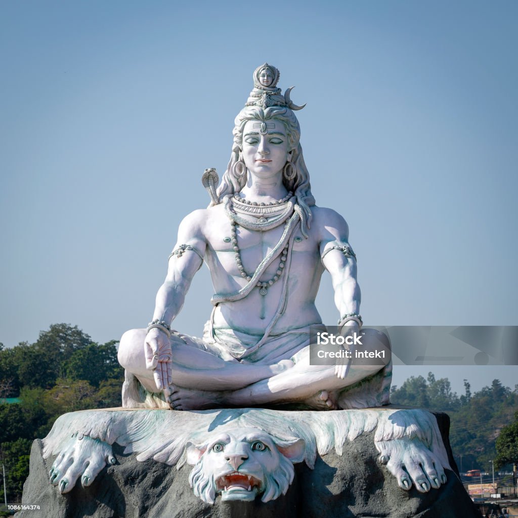 Statue of Shiva, Hindu idol on the Ganges River, Rishikesh, India Statue of Shiva, Hindu idol on the Ganges River, Rishikesh, India. The first Hindu God Shiva Shiva - Hindu God Stock Photo