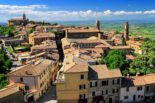 View of Montalcino town from the Fortress in Val d'Orcia, Tuscany, Italy. The town takes its name from a variety of oak tree that once covered the terrain.