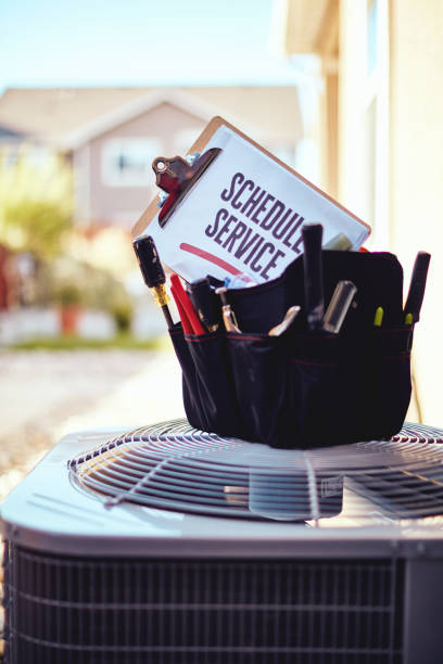 istock Air conditioner with maintenance tools and service reminder in residential back yard 1086182942