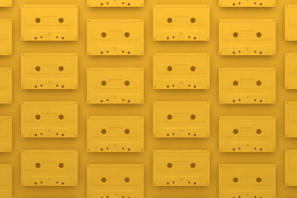 istock Retro tape cassette, yellow background 1086190000