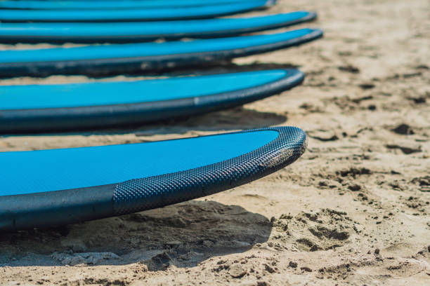 istock Blue surfboards in the sand on the beach 1086193788