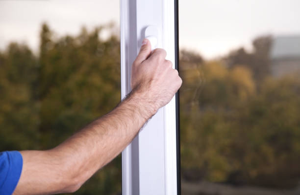 istock Male hand close white plastic pvc window at home. 1086199396