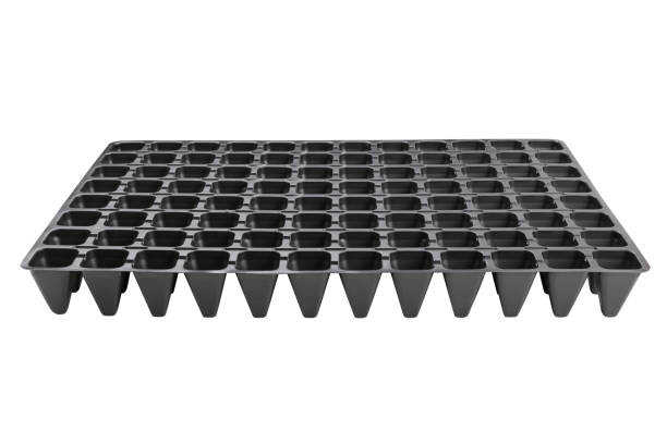 istock black plastic tray with cells for seedlings, on a white background 1086209540