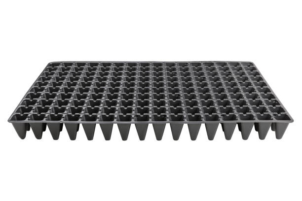 istock black plastic tray with cells for growing seedlings, on a white background 1086209548