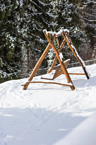 istock Wooden swing in the snow 1086211292