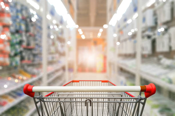 istock hardware store aisle with empty Red shopping cart 1086211674