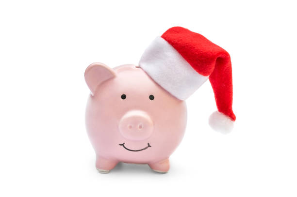 istock Piggy bank with santa's hat on white. 1086215690