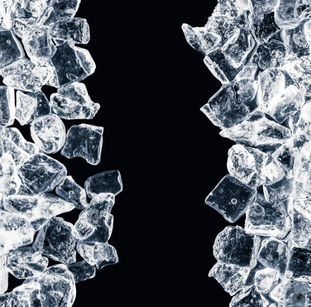 istock Pieces of crushed ice cubes on black background. 1086233666