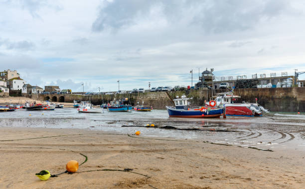 istock Fishing Boats at Low Tide, St Ives Harbour, North Cornwall. 1086236276