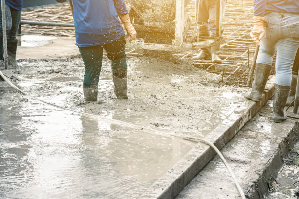 istock Pouring ready-mixed concrete from mixing mobile the concrete mixer into basket 1086237214