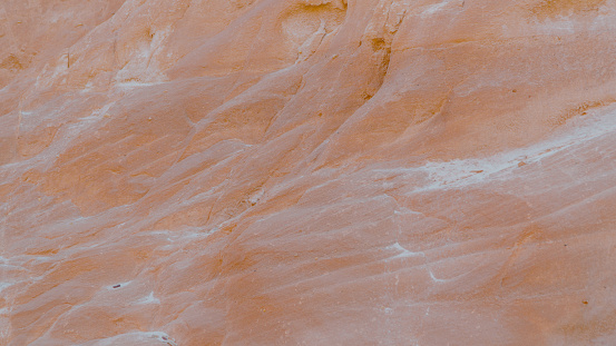 Closeup view of a sandstone rock face in Sedona, Arizona.