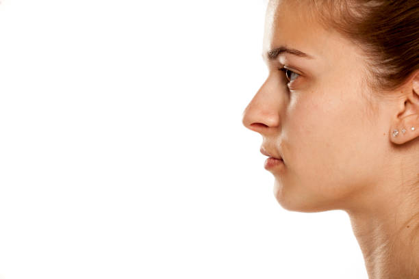 istock Profile of young serious woman on white background 1086242914