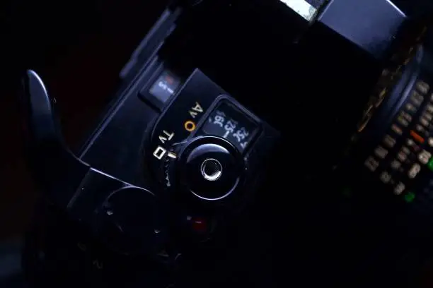 Close up shot of the Shutterspeed dial, shutter button and film advance crank of a 35mm film camera