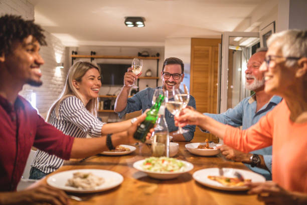 istock Multiracial family having a celebratory toast during a dinner party 1086253156