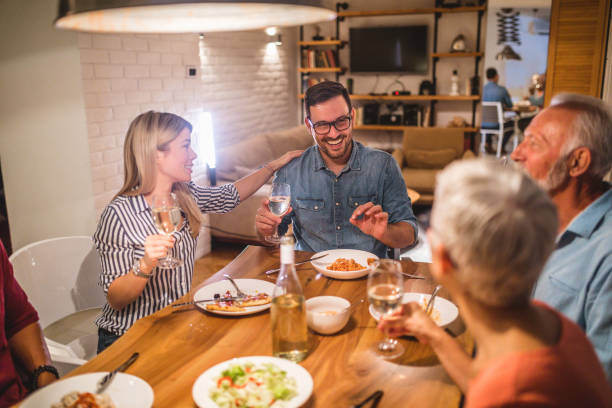 istock Cheerful family dining together 1086253242