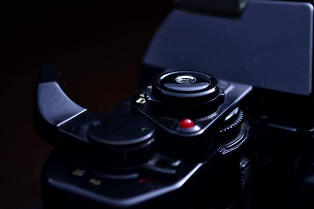 istock Shutterspeed dial, shutter button and film advance crank of a film camera 1086254536