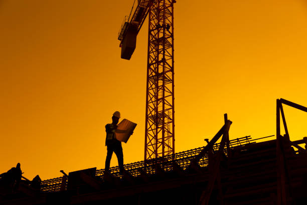 istock Silhouette of working man standing with his planning paper 1086258852