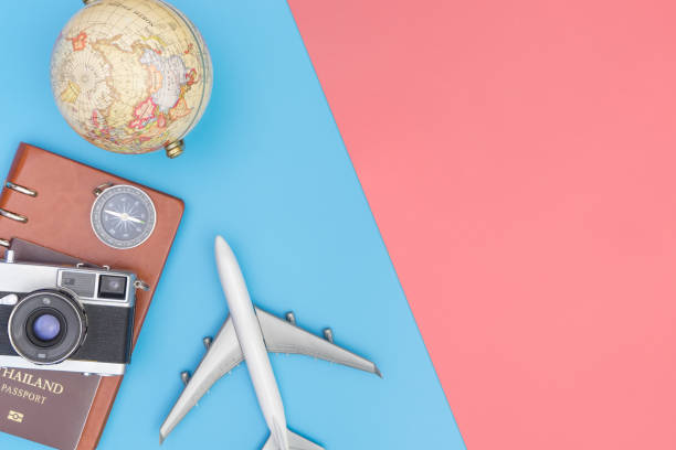 istock Travel accessories objects and gadgets top view flatlay on blue pink 1086262764