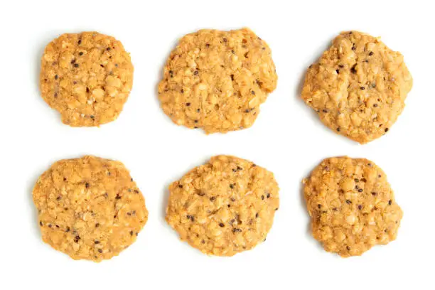 Close up vegan oatmeal chiaseeds cookies isolated on white background.