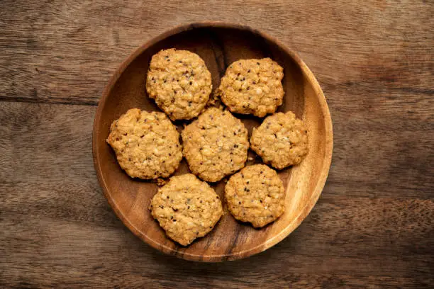 Vegan oatmeal chiaseeds cookies on plate with natural light.