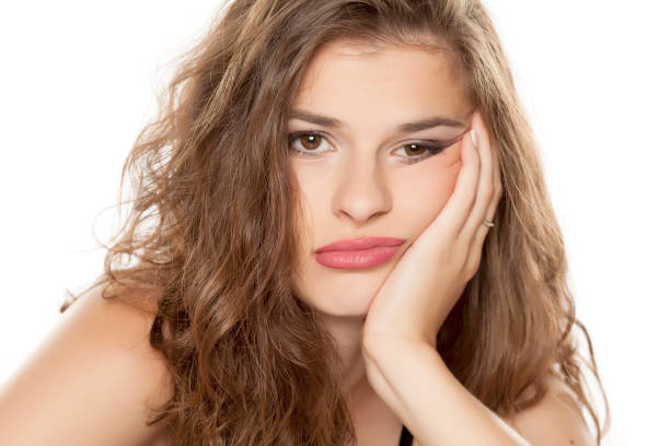 istock Young bored woman on white background 1086265818