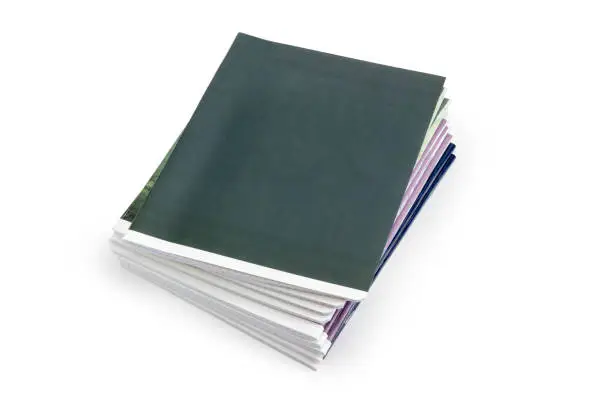 Stack of the different exercise book on a white background
