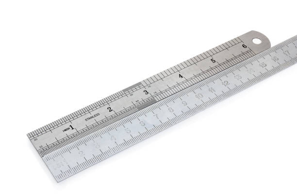 istock Two aligned metal measuring rulers in centimeters and inches 1086267328