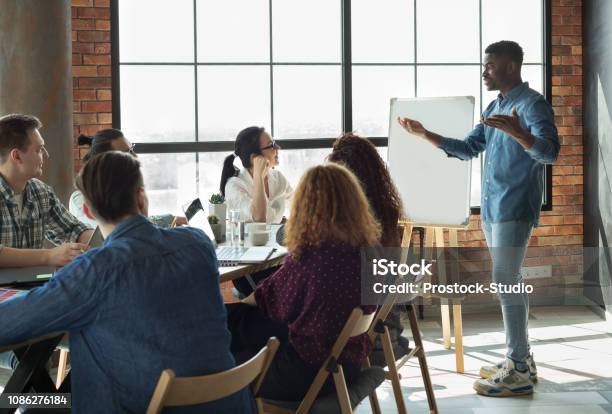 Africanamerican Leader Lecturing His Employees In Office Stock Photo - Download Image Now