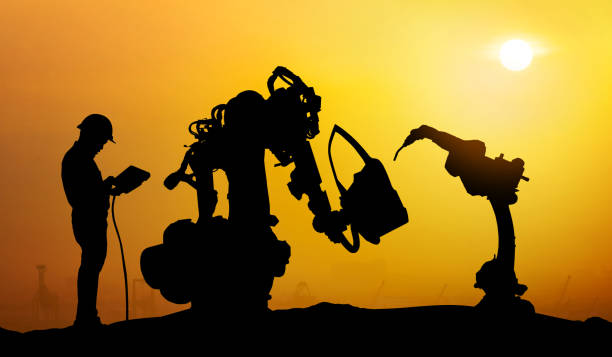 istock Robot assistant technology , industry 4.0 , artificial intelligence trend concept. Silhouette of business man talking to automation robo advisor arm. Bokeh flare light effect with sunrise background. 1086278006