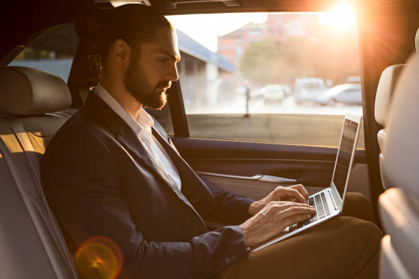 istock Businessman working in car 1086281280