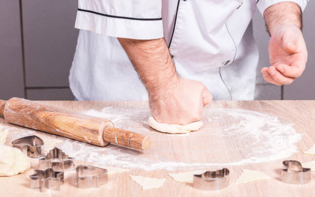 istock male cook preparing Christmas cookies 1086282634