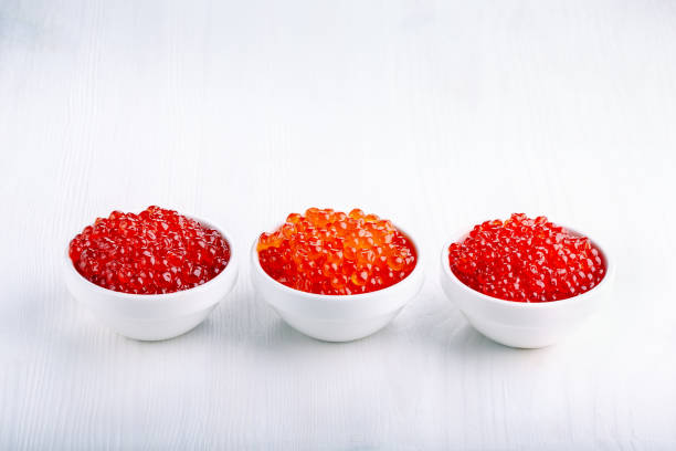 istock Different types of red caviar on white. Fish caviar, seafood. 1086287692