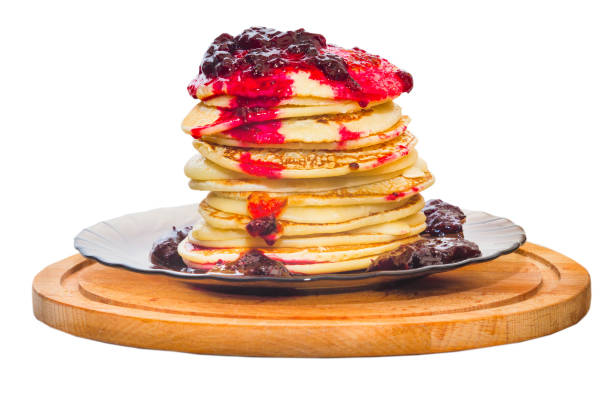 tower of pancakes with black currant jam