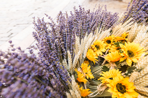 A provencal basket with lavender, wheat and sun flowers in Apt, Provence