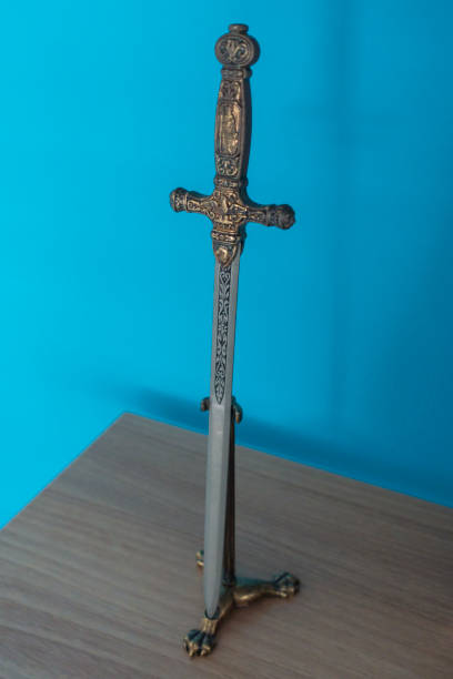 istock Middle age model sword on the wooden shelf. 1086295184