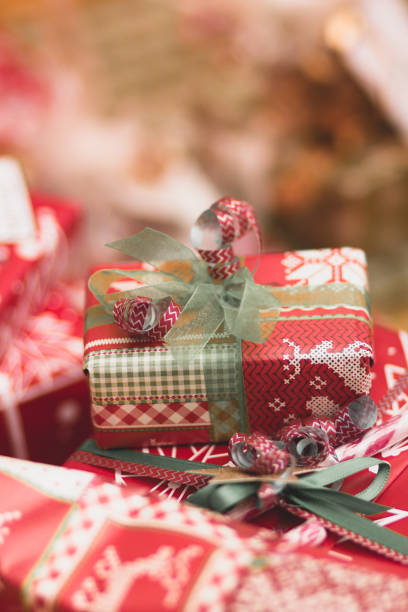 istock Big and small red, gold and silver christmas gift boxes 1086304252