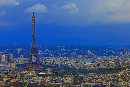 Paris, France - July 09 2020: Aerial view the Eiffel Tower from Tour Montparnasse observation desk with the Trocadero and La Defense business district in the background - Paris, France