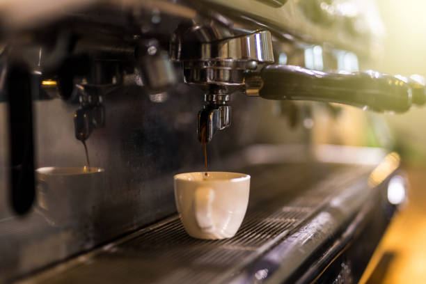 istock Coffee extraction from professional coffee machine. Coffee shop. 1086306506