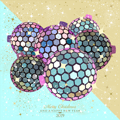 Hexagon disco balls in iridescent and gold with stars and sparkles on teal trendy background with the text Merry Christmas and a Happy New Year 2019