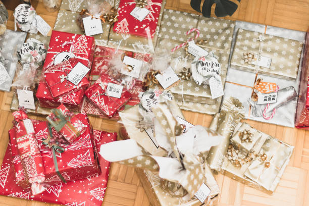 istock Big and small red, gold and silver christmas gift boxes 1086306868