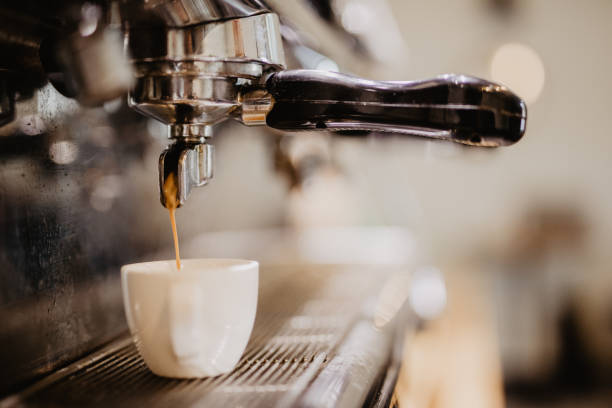 istock Coffee espresso machine. Espresso machine making coffee, golden espresso flowing. 1086308696
