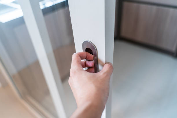 istock hand Close or Open glass door 1086309638