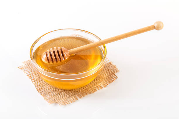 istock Fresh honey in glass bowl 1086313582